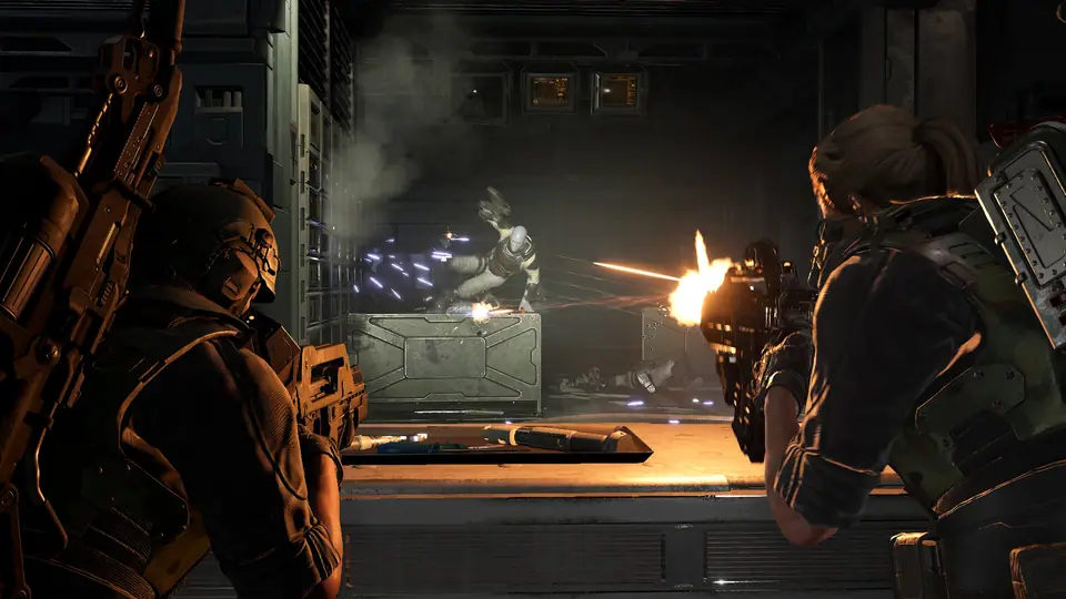 Colonial Marines engaging a Xenomorph across a dark corridor