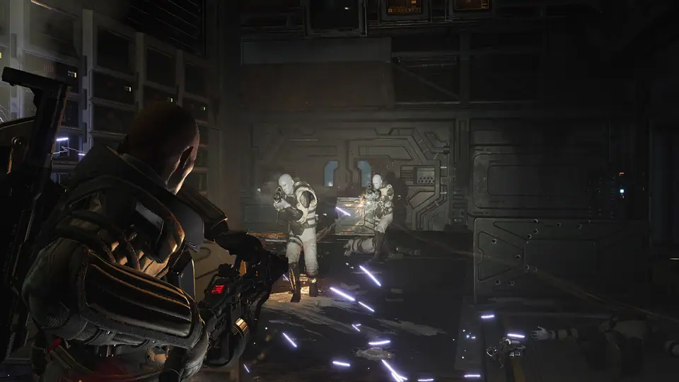 Colonial Marines advancing together through a dim corridor